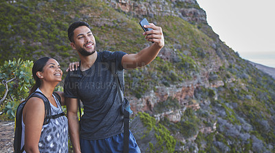Buy stock photo Couple, selfie and happy for hiking on mountain with backpack, adventure and morning workout for fitness. People, trail walk and photo for fun memories, social media post and profile picture update