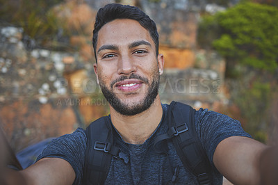 Buy stock photo Man, selfie and portrait for hiking on mountain with backpack, adventure and morning workout for fitness. Person, trail walk and photo for memories, social media post and profile picture update