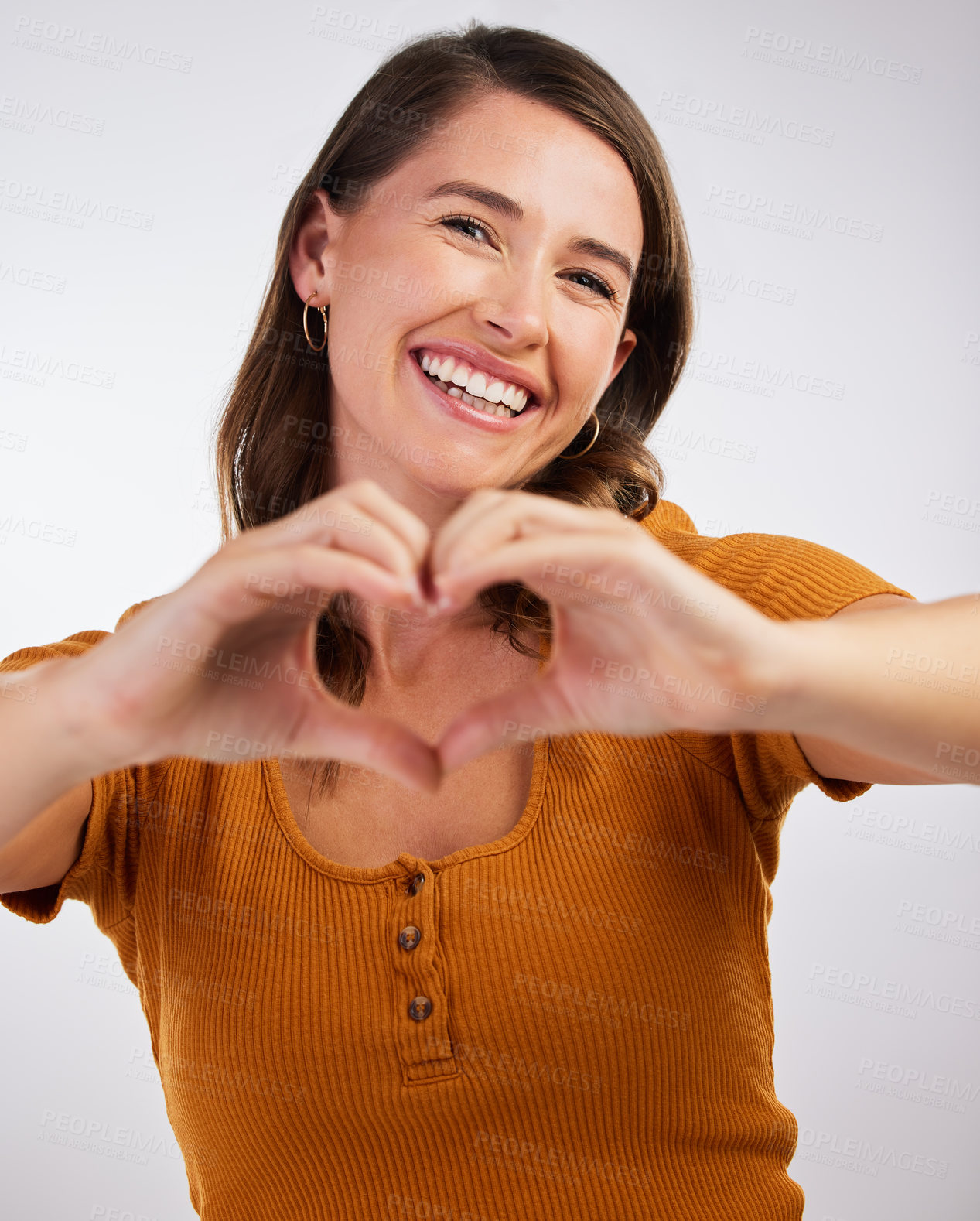 Buy stock photo Happy woman, portrait and heart hands with emoji for love, romance or care on a gray studio background. Young female person with smile for hearty shape, like sign and romantic gesture or symbol