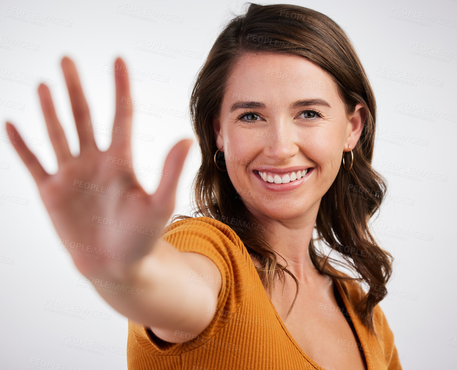 Buy stock photo Hand, hello and portrait of happy woman in studio for volunteering, donation or promotion on white background. Palm, wave or friendly model with greeting emoji for attention, stop or sign up reminder