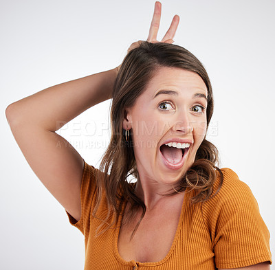 Buy stock photo Bunny ears, hands and portrait with woman and smile with rabbit emoji, excited and gesture in studio. University student, casual and modern fashion with clothes and confidence with white background