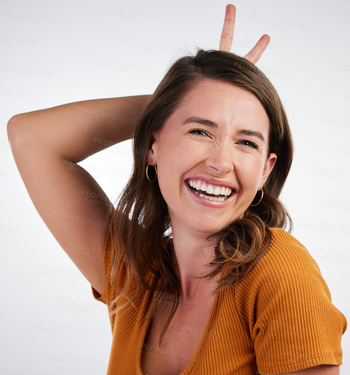 Buy stock photo Bunny ears, hands and laugh portrait with woman and smile with rabbit emoji, excited and gesture in studio. University student, casual and fashion with clothes and confidence with white background