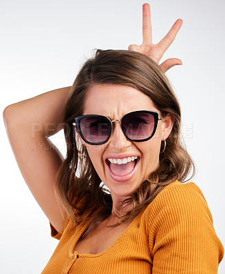 Buy stock photo Bunny ears, hands and sunglasses portrait with woman and smile with rabbit emoji, excited and gesture in studio. University student and fashion with clothes and confidence with white background