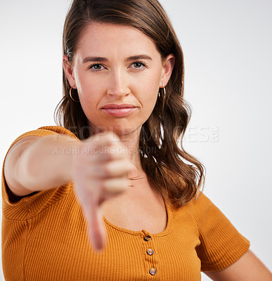 Buy stock photo Woman, portrait and thumbs down rejection in studio for vote, voice or opinion, rating or fail on white background. Face, no or model show emoji feedback, review or warning, gesture or disappointment