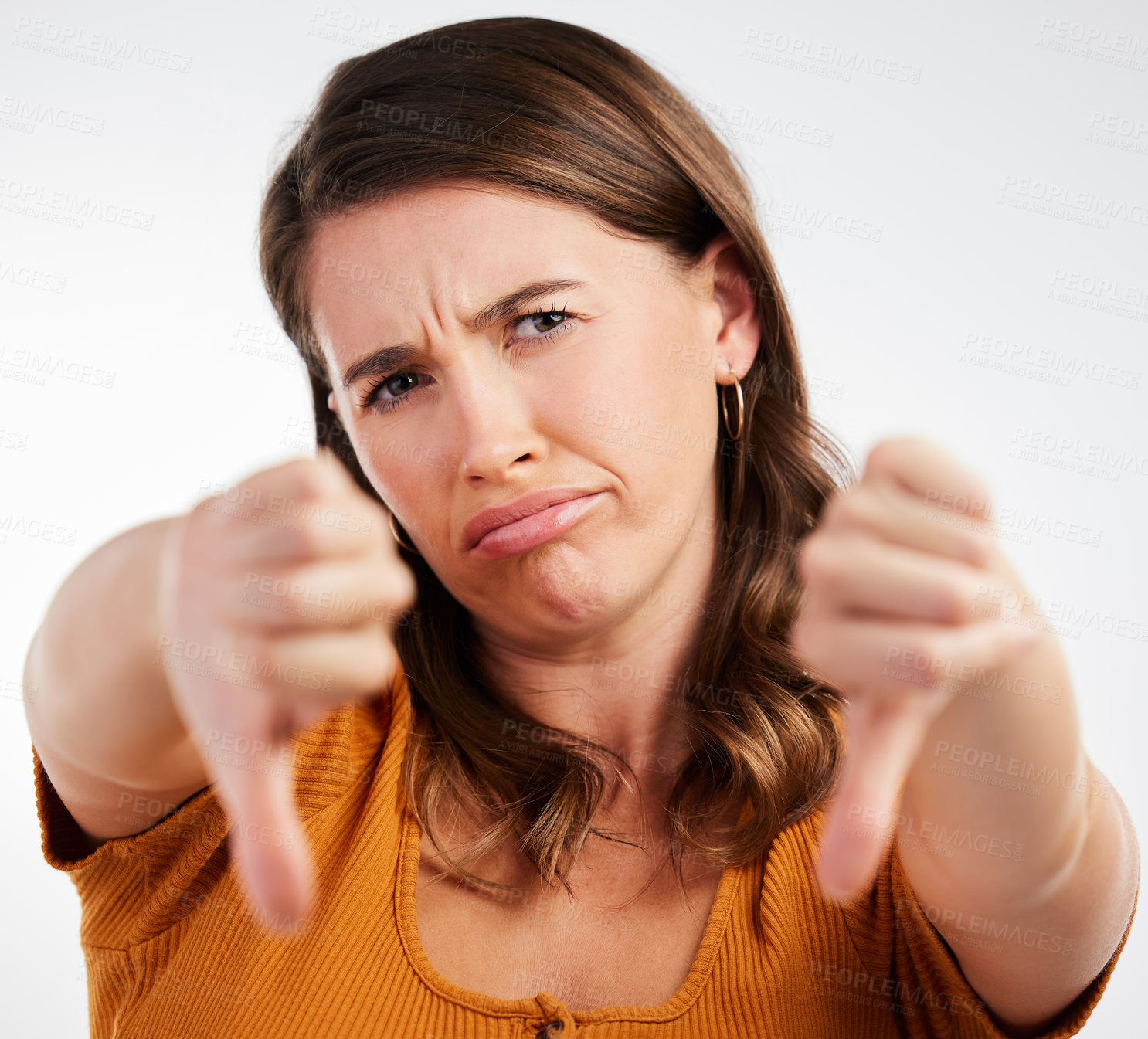 Buy stock photo Portrait, frown and woman with thumbs down rejection for studio vote, voice or opinion on white background. Face, no or sad model show emoji feedback, review or warning, gesture or loss problem