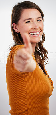 Buy stock photo Happy woman, portrait and well done with thumbs up for winning or success on a gray studio background. Female person with smile, like emoji or yes sign for ok, good job or thank you for approval