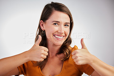Buy stock photo Happy woman, portrait and winning with thumbs up for success or good job on a white studio background. Female person with smile, like emoji or yes sign for ok, well done or thank you for approval