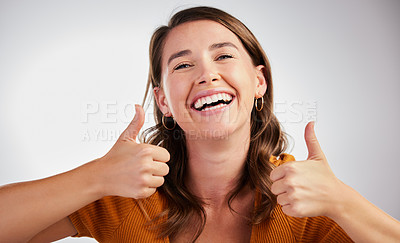 Buy stock photo Happy woman, portrait and good job with thumbs up for winning or reaction on a gray studio background. Female person with smile, like emoji or yes sign for ok, well done or thank you for approval