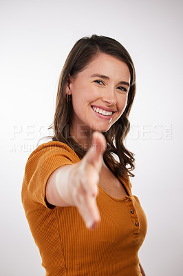 Buy stock photo Happy woman, portrait and studio with handshake for introduction, meeting or greeting on a white background. Female person or young creative with smile for shaking hands, thank you or partnership