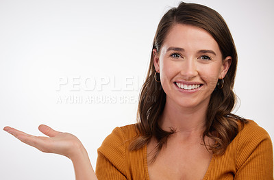Buy stock photo Studio, woman and hand for product placement with mockup space on white background. Gesture, portrait  and commercial promotion for announcement or deal with happy  female model, presentation or sale