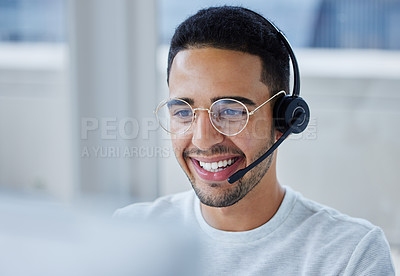 Buy stock photo Shot of a young businessman working at his desk in his office