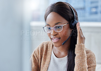 Buy stock photo Shot of a businesswoman at her desk in her office