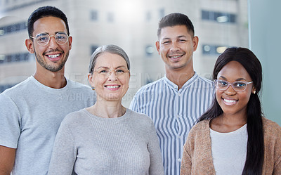 Buy stock photo Shot of a diverse team of coworkers together in their office at work