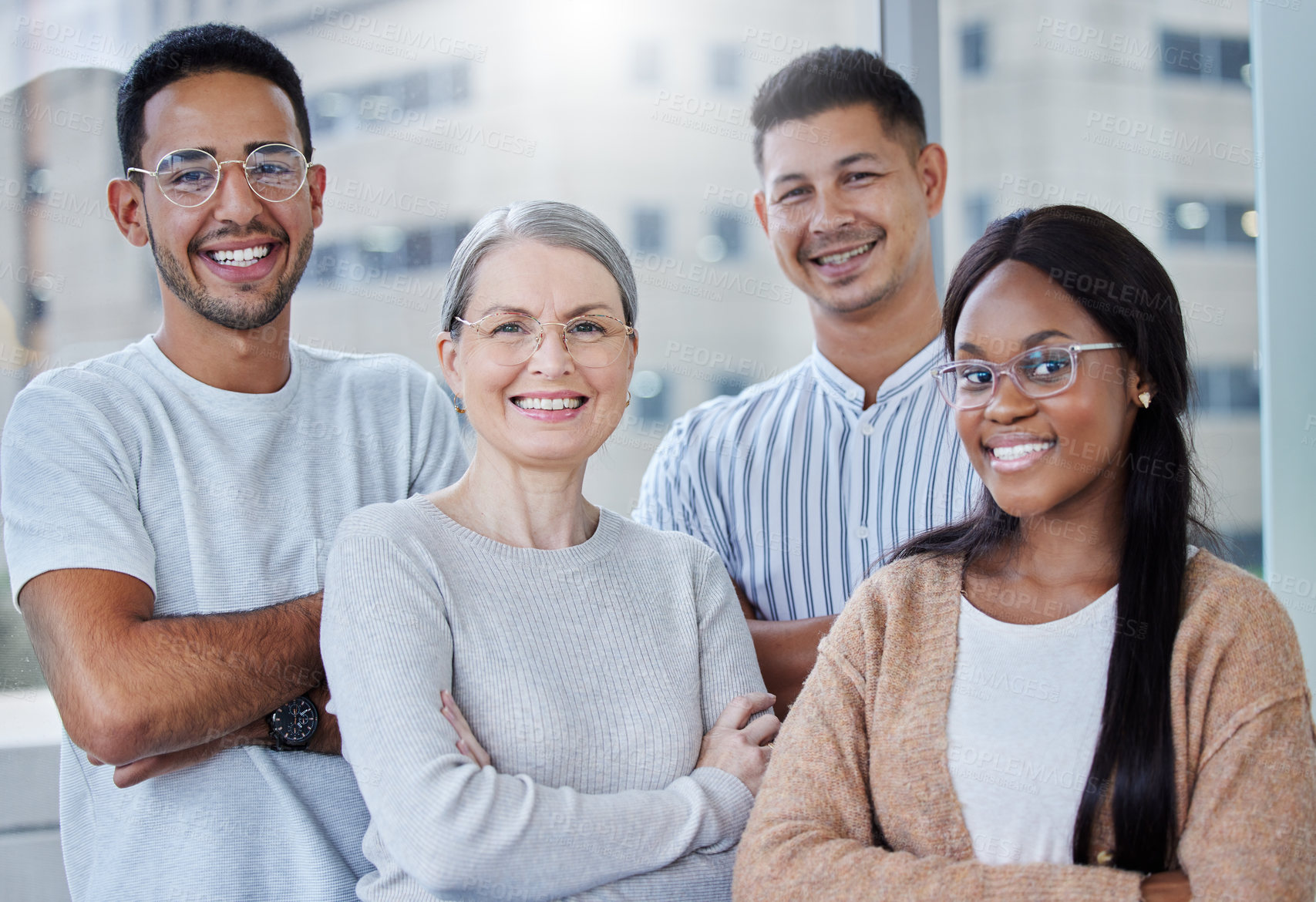 Buy stock photo Shot of a diverse team of coworkers together in their office at work