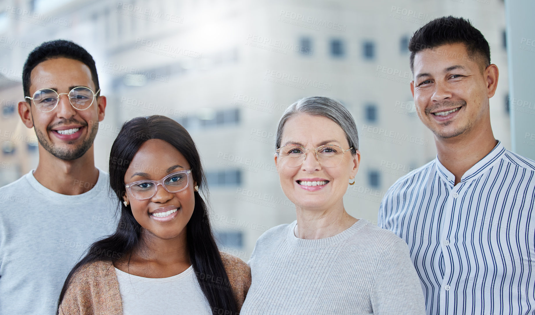 Buy stock photo Shot of a diverse group of work colleagues together in their office
