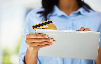 Buy stock photo Shot of an unrecognizable person using their digital tablet to shop online