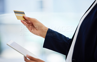 Buy stock photo Shot of an unrecognizable person using their digital tablet to shop online