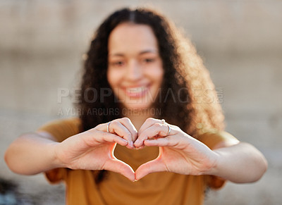 Buy stock photo Smile, heart hands and portrait of woman for love, positive and support against wall. Happiness, gesture and face of gen z female person for emoji, symbol of kindness or affection in outdoor
