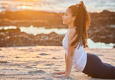Buy stock photo Beach, sunset and woman with stretching in yoga for muscle relief, balance or mindfulness. Healthy workout, zen and female person with cobra exercise for flexibility, chakra healing and awareness