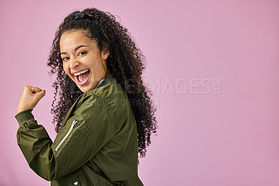 Buy stock photo Portrait, space and winner with woman on pink background in studio for celebration of bonus. Emoji, fist and mockup with happy person cheering for achievement, motivation and promotion success