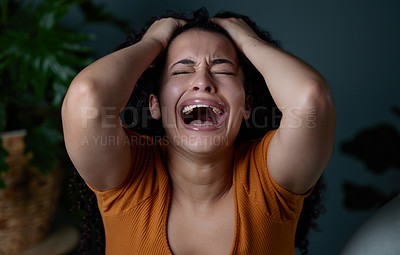 Buy stock photo Shot of a young woman feeling unhappy at home