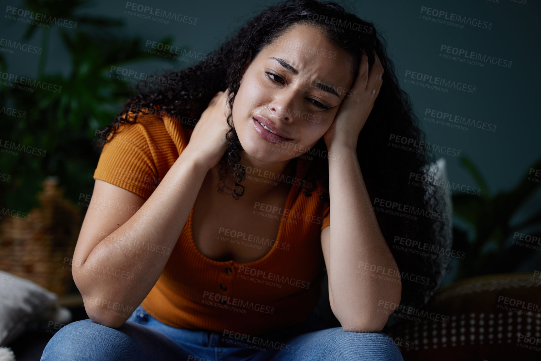 Buy stock photo Shot of a young woman feeling unhappy at home