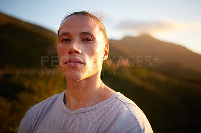 Buy stock photo Portrait, fitness and nature with a man runner outdoor for a cardio or endurance workout at sunset. Exercise, health and mindset with a young male athlete taking a break while running or training