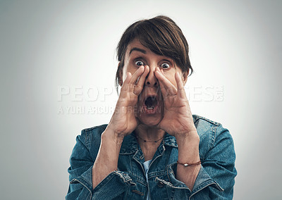Buy stock photo Studio portrait of a senior woman shouting against a grey background