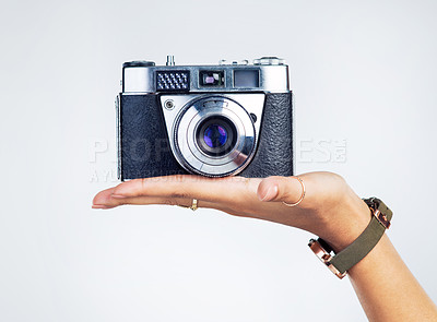 Buy stock photo Cropped shot of an unrecognizable woman holding up a camera