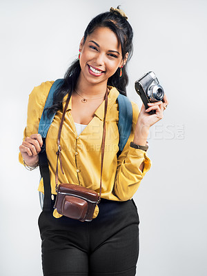 Buy stock photo Shot of a woman holding up her camera and dressed for an adventure