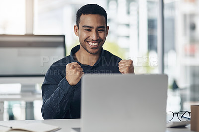 Buy stock photo Young business man, celebration and laptop with smile, winning or success on stock market in office. Indian businessman, computer and winner fist to celebrate profit, bonus or online gambling at desk