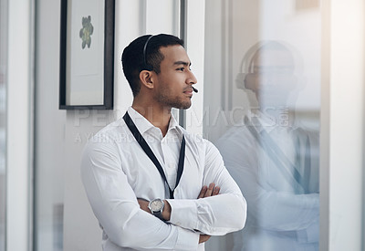 Buy stock photo Thinking, business and man with arms crossed, window and decision with choice, opportunity and headphones. Male person, employee or agent with thoughts, ideas or tech support with professional career