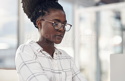 Buy stock photo Professional, woman and focus on laptop for entrepreneurship in Africa on the internet. Female employee, reading and computer screen for company with technology and glasses for digital design.