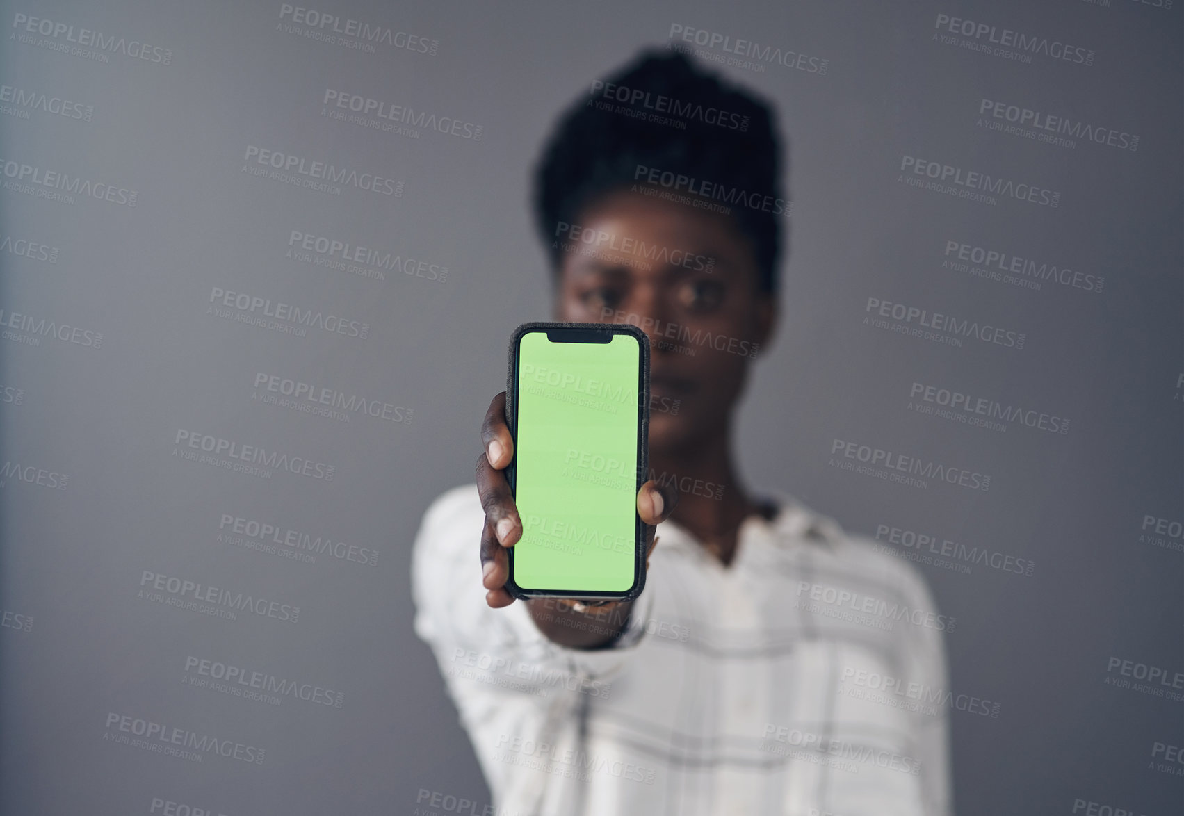 Buy stock photo Green screen, phone and woman in portrait isolated on a studio background for advertising space or mockup. Online mock up, show and african person with social media, networking or marketing design