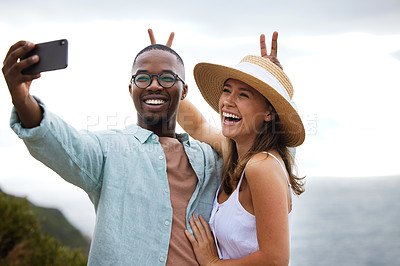 Buy stock photo Road trip, interracial couple and funny for selfie in nature, travel and countryside for vacation in Brazil. Comic, people and happy using phone for picture for holiday, journey and smile together