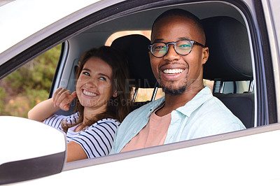 Buy stock photo Shot of a happy young couple going on a road trip