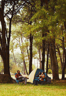 Buy stock photo Camp, nature and couple relax in chair with morning drink, chat or happy vacation with outdoor adventure. Forest, man and woman bonding together on holiday with coffee, tent and conversation in woods
