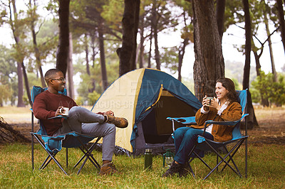 Buy stock photo Camping, nature and couple relax in chair with morning drink, chat or happy vacation with outdoor adventure. Forest, man and woman bonding together on holiday with coffee, tent and getaway in woods
