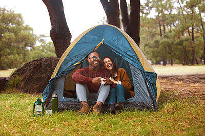 Buy stock photo Camp, nature and couple relax in tent with morning drink, chat or happy vacation with laughing. Forest, man and woman bonding together on holiday with coffee, romance and outdoor adventure in woods