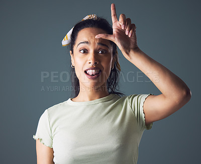 Buy stock photo Woman, portrait and hand with loser sign in studio on grey background for negative, attitude or fail. Female person, face and finger gesture with bullying judgement or mean blame, mistake or mockup