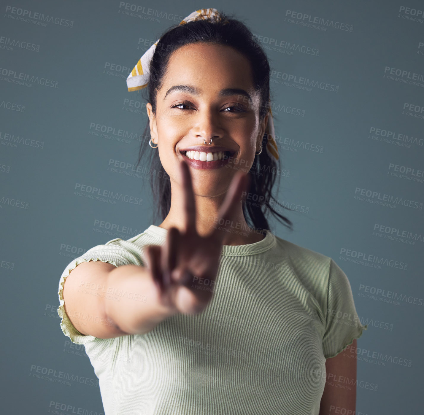 Buy stock photo Woman, portrait and peace sign with smile in studio for friendly support, well done or grey background. Female person, face and model with v fingers or emoji gesture for happiness, positive or mockup