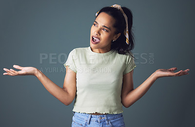 Buy stock photo Girl, fashion and confused as gen z in studio on grey background in casual, style and elegant. Mexican woman, puzzled and clueless on decision with clothes or street wear and outfit for trends 