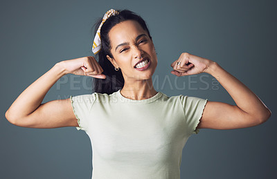 Buy stock photo Girl, fashion and strength as gen z in studio on grey background in casual, style and elegant. Portrait, female person and power or strong with clothes or muscle and outfit for empowerment 

