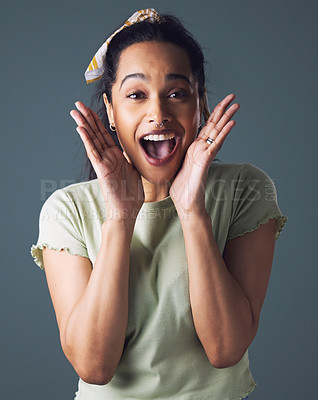 Buy stock photo Happy, surprise and portrait of woman in studio with notification, discount and announcement. Female person, excited emoji and hands on face for information, good news and winning on grey background