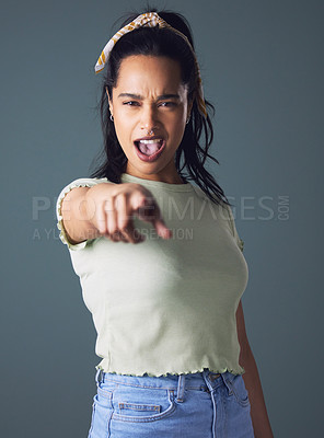 Buy stock photo Woman, pointing and portrait in studio for you, choosing and decision on dark background for playful. Young people, crazy and gesture for choice or select with confident attitude and good mood 