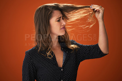 Buy stock photo Confused, sad and hair loss of woman, studio and stress with worry, fragile and texture of hairdo. Red background, mockup and girl with hereditary of baldness, fear and unhappy with haircare in salon