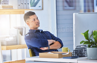 Buy stock photo Young businessman, thinking and desk, computer and arms crossed in office for startup company. Financial advisor, documents and research for investment, stock market and project in workplace