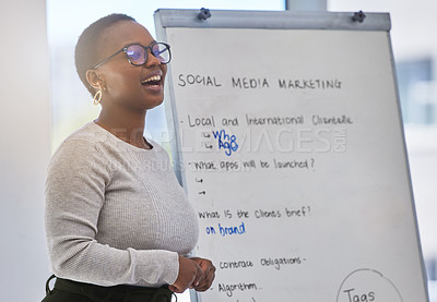 Buy stock photo Shot of a young woman giving a presentation in a modern office