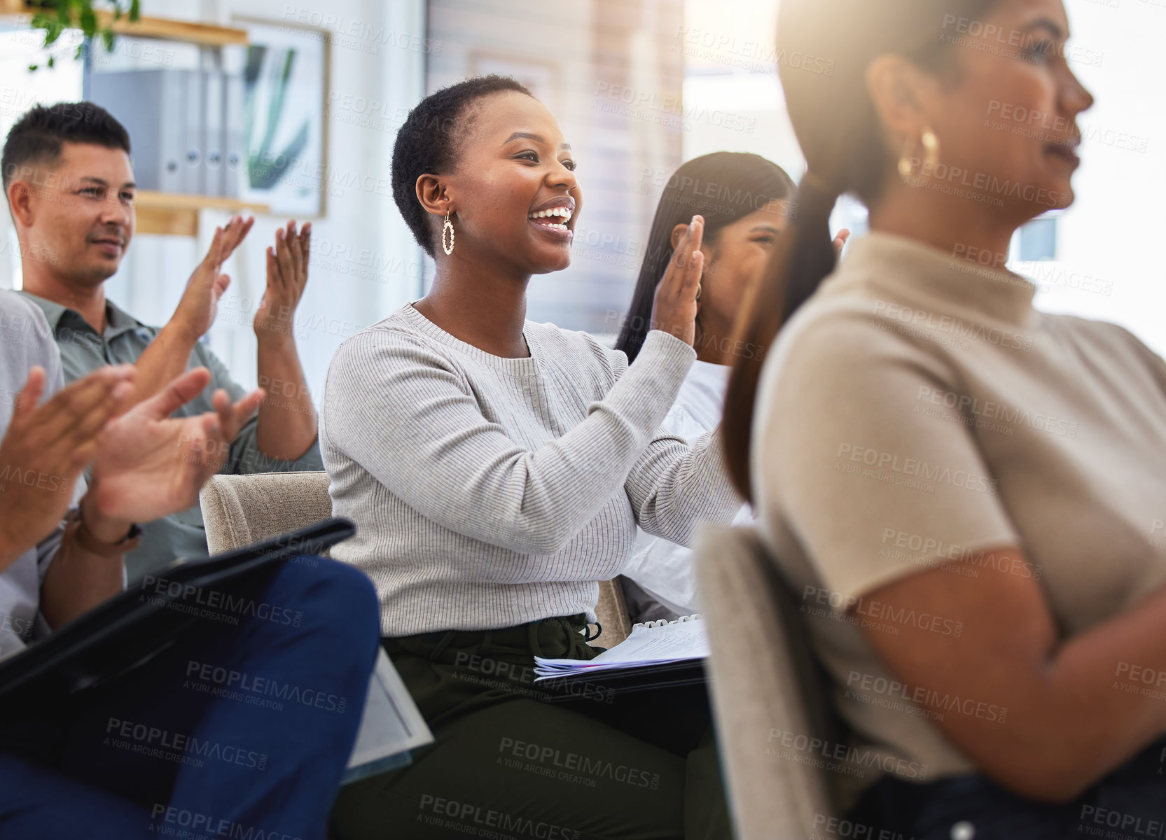 Buy stock photo Shot of a group of people clapping and smiling during a meeting at work