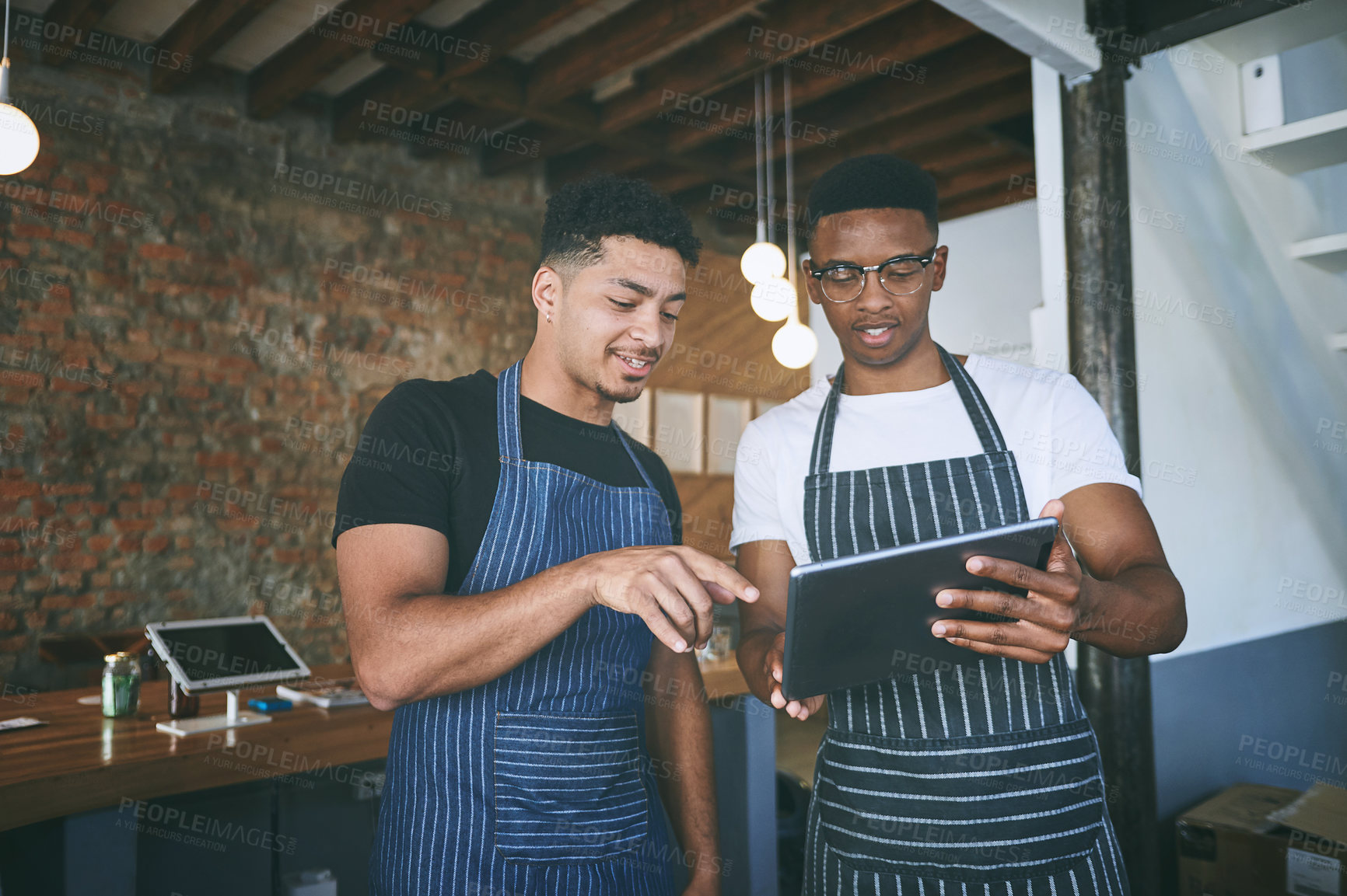 Buy stock photo Waiter, team and talking with tablet in restaurant for barista training, order entry and POS system. Small business, manager and men with cafe app to explain online inventory, menu update or planning